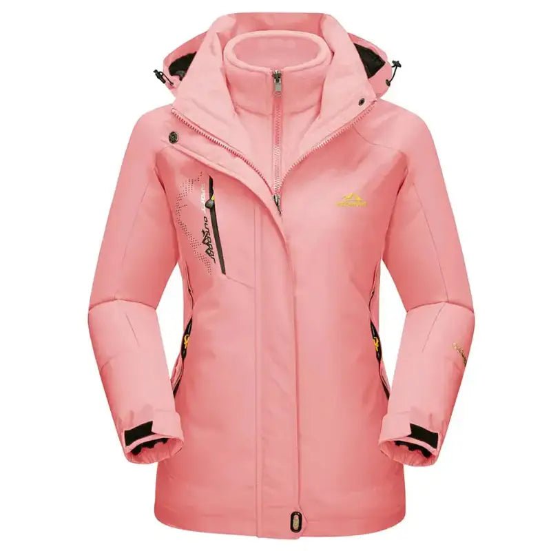 Parka femme à capuche technique en rose avec capuche et poches fonctionnelles.