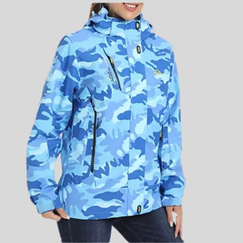 Parka femme à capuche en motif camouflage bleu, légère et déperlante, idéale pour les journées fraîches.