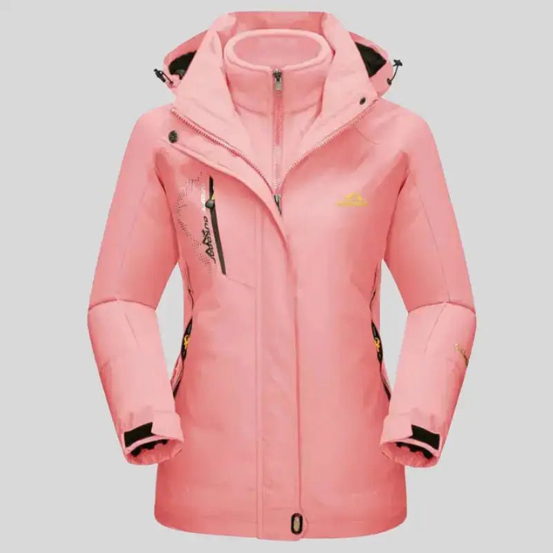 Parka femme à capuche rose avec fermeture éclair et capuche ajustable.